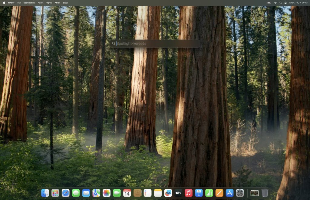 Spotlight keresős&aacute;v a k&eacute;pernyő k&ouml;zep&eacute;n egy Mac &iacute;r&oacute;asztalon